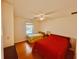 Bright bedroom featuring two twin beds, a ceiling fan and wood-look flooring at 1711 Lafayette Ave # 5, Lebanon, IN 46052