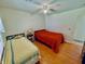 Bright bedroom featuring two twin beds, a ceiling fan and wood-look flooring at 1711 Lafayette Ave # 5, Lebanon, IN 46052