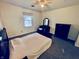 Bedroom with neutral colored carpet and a dark wood bedroom set at 1711 Lafayette Ave # 5, Lebanon, IN 46052
