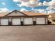 Row of multiple garages in an exterior view with dark asphalt driveways at 1711 Lafayette Ave # 5, Lebanon, IN 46052