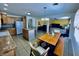 Kitchen and dining area with island and table with bench seating at 1711 Lafayette Ave # 5, Lebanon, IN 46052