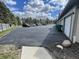 Parking lot area with multiple parked cars and several garages at 1711 Lafayette Ave # 5, Lebanon, IN 46052