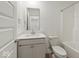 Bathroom featuring a single sink vanity with white countertop, a shower-tub combo, and tile floors at 17293 Rancorn Pl, Westfield, IN 46074