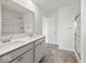 Bright bathroom with double sink vanity, white countertops, and glass shower doors at 17293 Rancorn Pl, Westfield, IN 46074