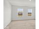 Bright bedroom with two windows providing natural light and views of the surrounding neighborhood at 17293 Rancorn Pl, Westfield, IN 46074