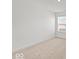 Bright bedroom with neutral carpet, white walls, and a window offering natural light at 17293 Rancorn Pl, Westfield, IN 46074