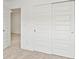 Bright bedroom featuring sliding closet doors and a doorway into the adjoining room at 17293 Rancorn Pl, Westfield, IN 46074