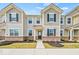 Charming two-story townhome featuring a brick facade and neutral siding, complemented by black shutters and well-maintained landscaping at 17293 Rancorn Pl, Westfield, IN 46074