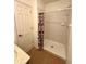 Cozy bathroom featuring shower with curtain, door, and vanity, providing functionality in a compact space at 1836 Queensbridge N Cir, Indianapolis, IN 46219