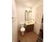Functional bathroom with toilet, vanity, mirror, and shower access, designed for everyday convenience at 1836 Queensbridge N Cir, Indianapolis, IN 46219