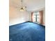 Bedroom with vaulted ceiling, large window, and cozy carpeting at 1836 Queensbridge N Cir, Indianapolis, IN 46219