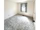Bright bedroom with natural light from the window and soft carpet, creating a cozy retreat at 1836 Queensbridge N Cir, Indianapolis, IN 46219