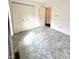 Well-lit bedroom with large closets and soft carpet flooring, offering ample storage space at 1836 Queensbridge N Cir, Indianapolis, IN 46219