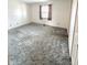Spacious bedroom featuring neutral walls, soft carpet, and a bright window for natural light at 1836 Queensbridge N Cir, Indianapolis, IN 46219