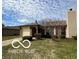 Charming single-story home with a well-maintained lawn and attached garage at 1836 Queensbridge N Cir, Indianapolis, IN 46219