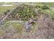 Stunning aerial view of the property, highlighting the house, pond, and surrounding landscape at 222 Stony Ln, Noblesville, IN 46060