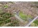 Aerial shot of the sprawling property featuring the home, pond, garage, and surrounding landscape at 222 Stony Ln, Noblesville, IN 46060