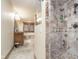 Stylish bathroom showcasing a glass-enclosed shower and a separate vanity area with a soaking tub at 222 Stony Ln, Noblesville, IN 46060