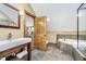 Bathroom boasts modern fixtures, a soaking tub, and sleek tiling, with adjacent bedroom view at 222 Stony Ln, Noblesville, IN 46060