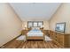 Cozy bedroom with wood furniture, neutral color palette, and natural light from the window at 222 Stony Ln, Noblesville, IN 46060