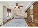 Charming bedroom with a daybed, wood floors, a ceiling fan and natural light from the window at 222 Stony Ln, Noblesville, IN 46060