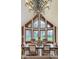 Elegant dining room featuring large windows, a chandelier, and hardwood floors, perfect for entertaining guests at 222 Stony Ln, Noblesville, IN 46060