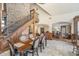 Bright and airy dining room with natural light, a beautiful staircase, and open access to the living areas at 222 Stony Ln, Noblesville, IN 46060