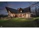 Attractive view of the house with its inviting porch, enhanced by soft lighting at 222 Stony Ln, Noblesville, IN 46060
