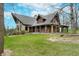 Charming home featuring a stone facade and a cozy, covered porch, framed by lush greenery at 222 Stony Ln, Noblesville, IN 46060