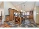 Kitchen featuring hardwood cabinets, a center island with seating, and stainless steel appliances at 222 Stony Ln, Noblesville, IN 46060