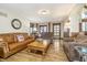 Cozy living room featuring plush sofas, a wooden coffee table, and tasteful decor, perfect for relaxation at 222 Stony Ln, Noblesville, IN 46060