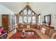 Living room area features large windows, comfortable seating, and natural light at 222 Stony Ln, Noblesville, IN 46060
