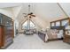 Spacious main bedroom featuring vaulted ceilings, large windows, and comfortable sitting area at 222 Stony Ln, Noblesville, IN 46060