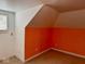 Attic bedroom with sloped ceilings, orange half-wall and window at 2275 N 250 E, Lebanon, IN 46052