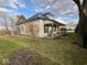 Exterior of home with a covered porch and a spacious lawn, showcasing a peaceful setting at 2275 N 250 E, Lebanon, IN 46052