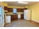 Functional kitchen with wooden cabinets and essential appliances, ready for culinary adventures at 2275 N 250 E, Lebanon, IN 46052