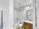 Cozy bathroom with a shower and tub combination, oak vanity, and neutral paint at 2632 Frasier Fir Dr, Greenwood, IN 46143