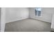 A bright bedroom space with light-colored walls and carpet at 2632 Frasier Fir Dr, Greenwood, IN 46143
