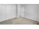 Bedroom featuring light-colored walls and carpet with ample closet space at 2632 Frasier Fir Dr, Greenwood, IN 46143