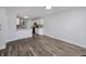 Open concept living room and kitchen featuring hardwood floors and neutral paint at 2632 Frasier Fir Dr, Greenwood, IN 46143
