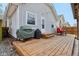 Cozy backyard deck features a grill, dining set, and convenient access to the home at 304 W 43Rd St, Indianapolis, IN 46208