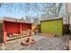 Backyard with fire pit, wood storage, and shed for outdoor activities and storage at 304 W 43Rd St, Indianapolis, IN 46208
