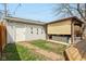 Backyard with outdoor lounge, deck, and grass with path leading to garage at 304 W 43Rd St, Indianapolis, IN 46208