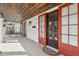 Covered front porch features a wood ceiling, tile flooring, and multiple entry doors at 304 W 43Rd St, Indianapolis, IN 46208