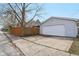 Detached garage with concrete driveway and fenced yard for added privacy and security at 304 W 43Rd St, Indianapolis, IN 46208