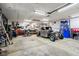 Spacious garage with workshop, storage solutions, and a vintage car project at 304 W 43Rd St, Indianapolis, IN 46208