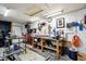 Functional garage workshop area with tools, workbenches, and various equipment at 304 W 43Rd St, Indianapolis, IN 46208