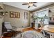 Cozy home office featuring built-in shelves, a ceiling fan, and hardwood floors at 304 W 43Rd St, Indianapolis, IN 46208
