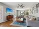 Living room showcases large sectional, hardwood floors, and an entertainment area at 304 W 43Rd St, Indianapolis, IN 46208