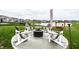 Landscaped backyard featuring a fire pit and comfortable seating perfect for entertaining guests at 3164 Kent Dr, Brownsburg, IN 46112